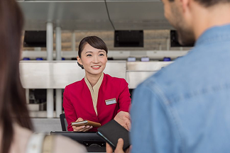 A couple checking in at Cathay's counter